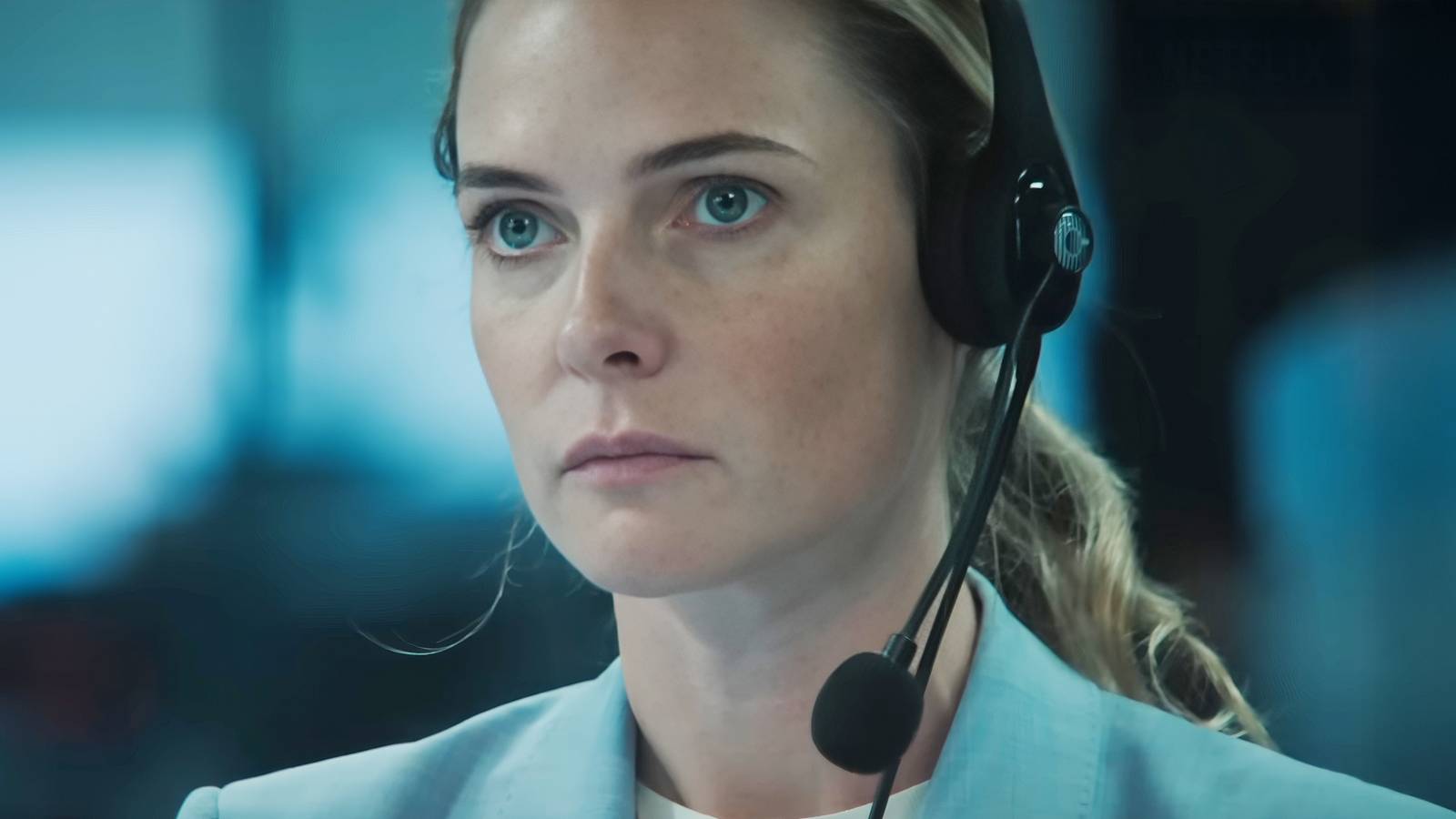 Rebecca Ferguson is serious while wearing a headset in A House of Dynamite