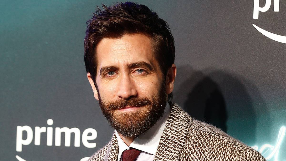 Jake Gyllenhaal smirking on a Prime Video red carpet
