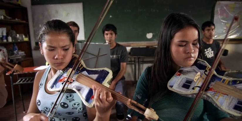 Children play musical instruments made out of recycled materials in Landfill Harmonic. 