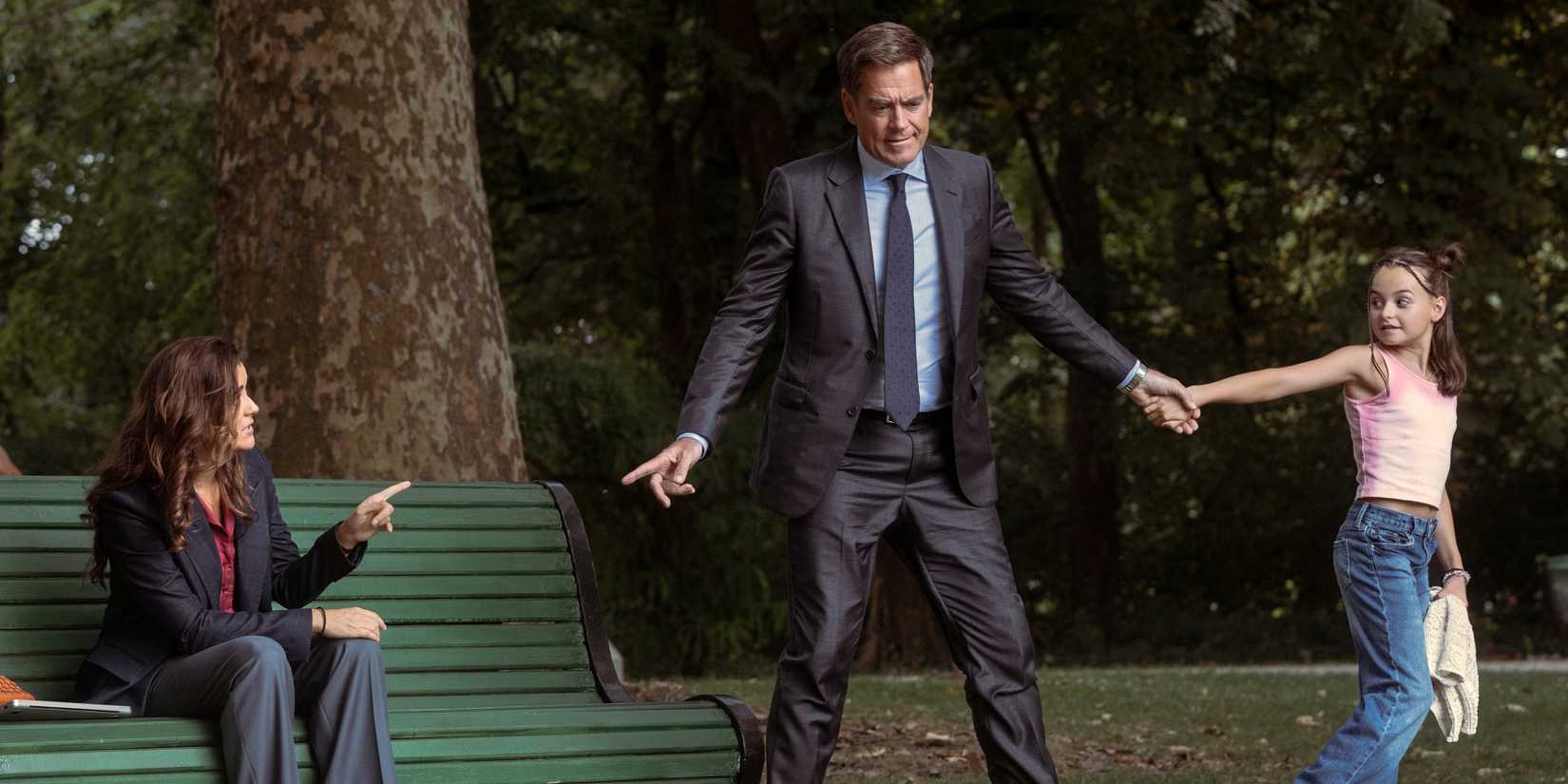 MIchael Weatherly as Tony being pulled away from Cote de Pablo as Ziva by their daughter in NCIS: Tony & Ziva