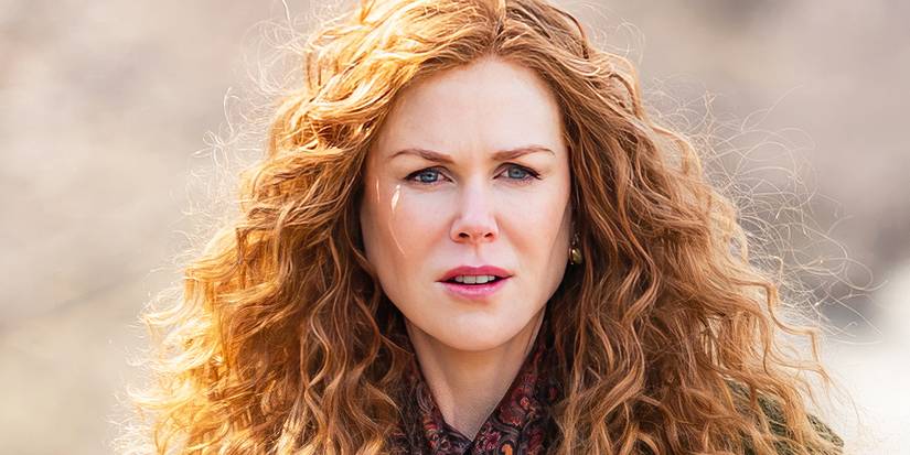 Nicole Kidman with curly red hair looks to the distance concerned in The Undoing.