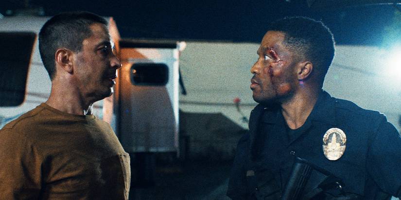 Justin Long and Jermaine Fowler as a cop looking at each other fearfully in Night Patrol (2025).