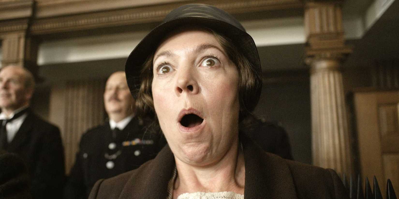 Olivia Colman as Edith Swan looking shocked in a hat in Wicked Little Letters.