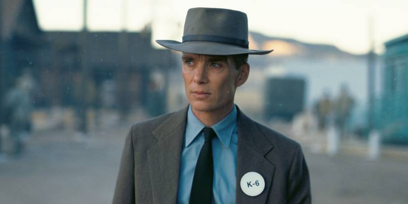Cillian Murphy as J. Robert Oppenheimer, standing outside in Oppenheimer (2023).