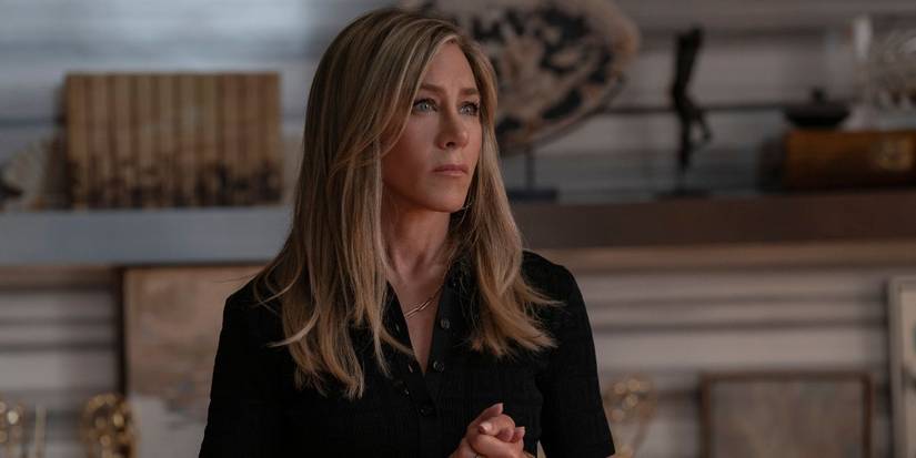 Jennifer Aniston as Alex Levy looking ahead with a serious expression in The Morning Show Season 4.