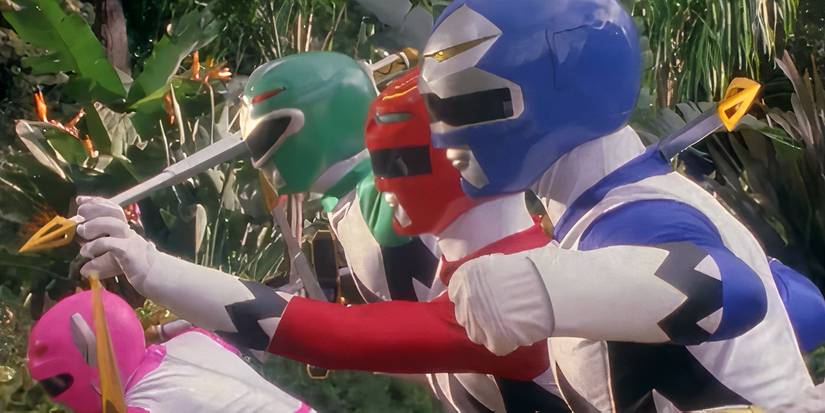 The Pink, Green, Red, and Blue Rangers ready to strike with swords in Power Rangers Lost Galaxy