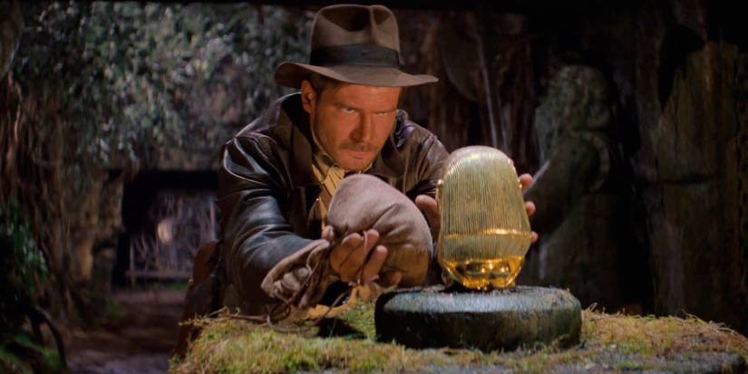 Harrison Ford about to take the golden idol in Raiders of the Lost Ark - 1981