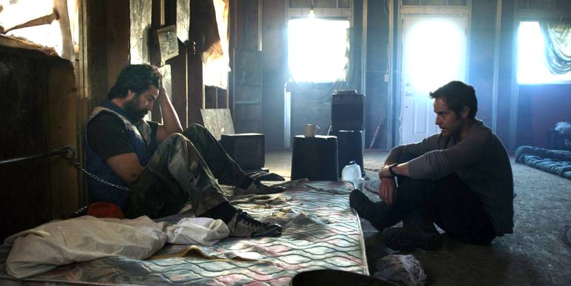Two men sitting on the floor in Resolution
