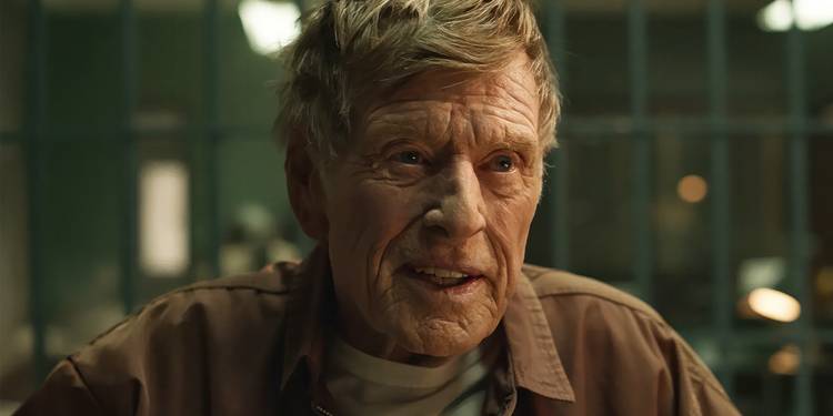 Robert Redford in prison talking to someone in Dark Winds