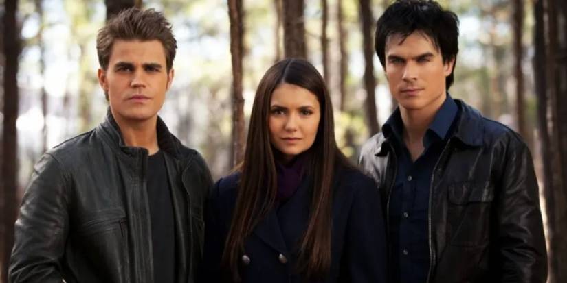 Paul Wesley, Nina Dobrev, Ian Somerholder as Stefan Elena, and Damon in a forest in 'The Vampire Diaries.'