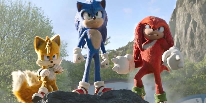 Sonic, Tails, and Knuckles stand on a rock together ready for battle in Sonic the Hedgehog 2