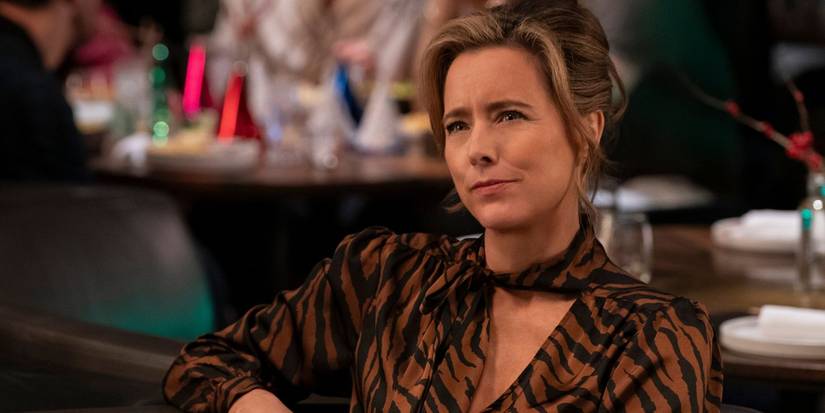 Sofia Caccimelio looking intently at a restaurant in Only Murders in the Building