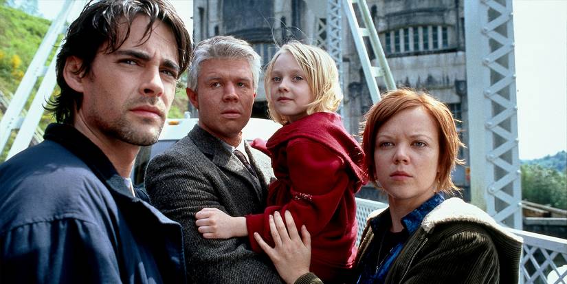 Charlie, Allie, Lisa, and Tom standing together on a bridge