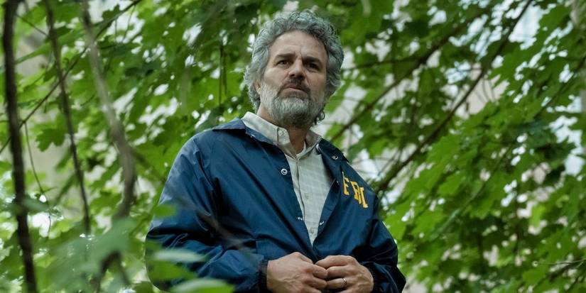 Mark Ruffalo wearing an FBI jacket in the woods in Task Episode 2.