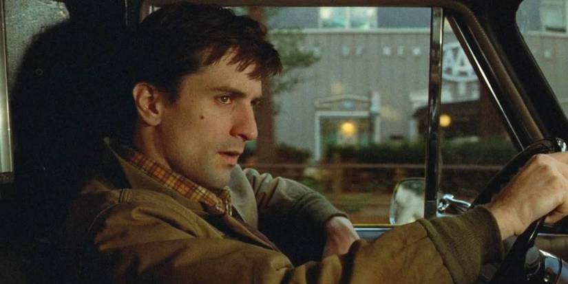 Robert De Niro como Travis Bickle dirigindo um táxi em Taxi Driver (1976).