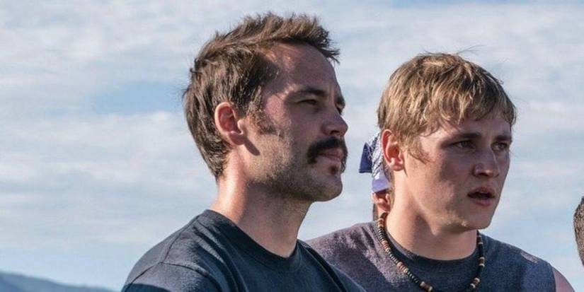 Taylor Kitsch looking stern and Ben Hardy looking confused next to him in Only the Brave