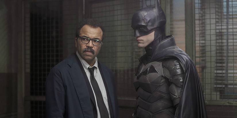 Robert Pattinson and Jeffrey Wright stand side by side in The Batman.