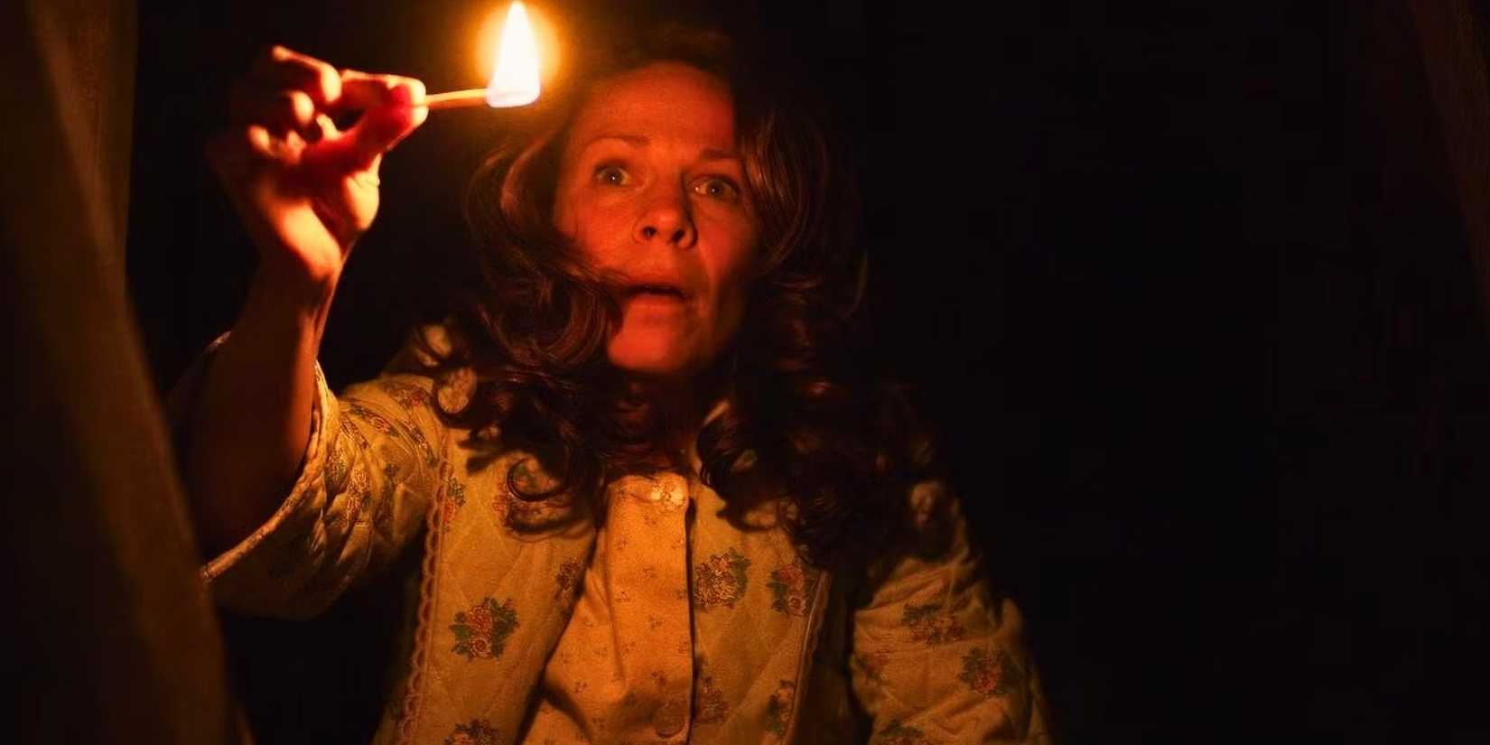Lili Taylor with a lit match in The Conjuring