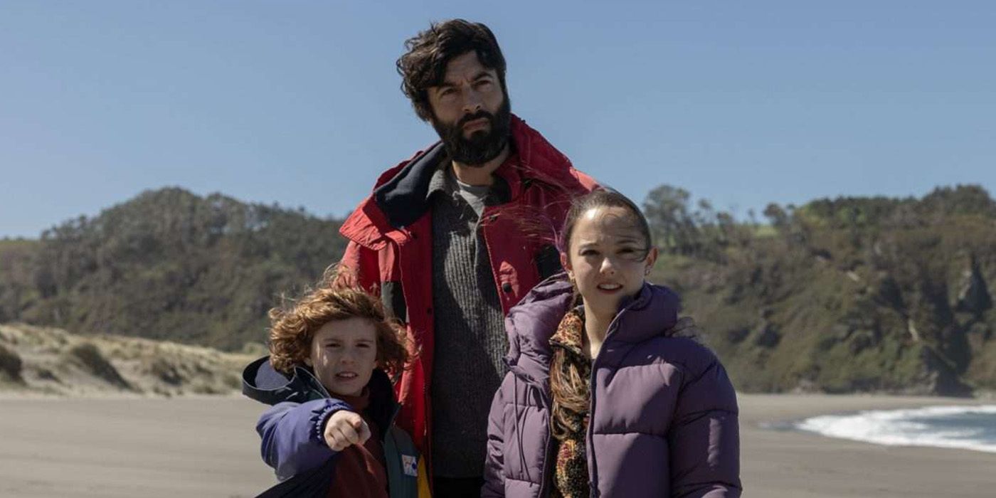 Alex with his children on the beach