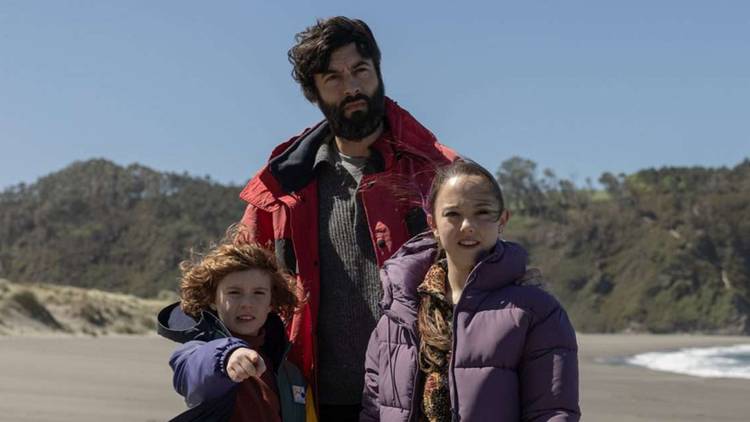 Alex with his children on the beach