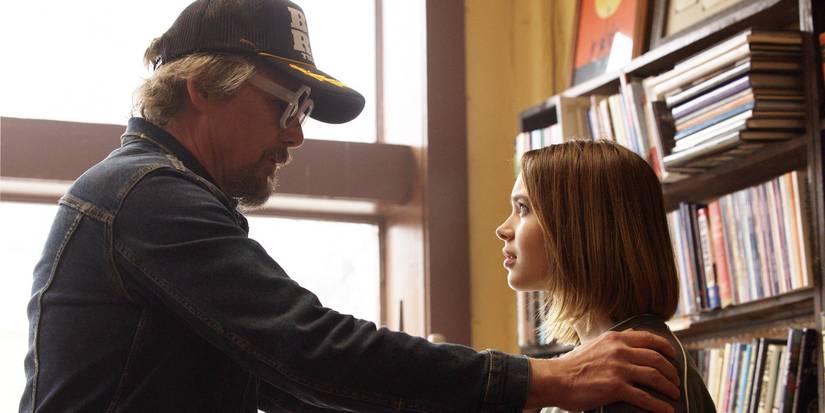 Ethan Hawke as Lee Raybon reaching out to Ryan Kiera Armstrong as his daughter Francis in The Lowdown