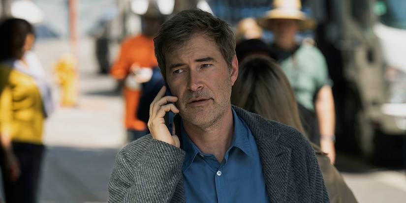 Chip talking on the phone while walking down the street in The Morning Show.