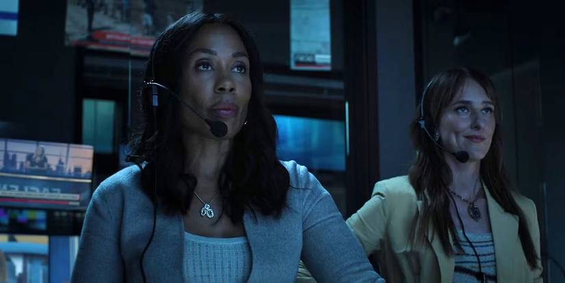 Mia in the control room looking up with a headset on, another woman behind her in The Morning Show.