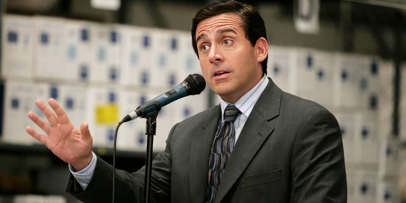 Steve Carell's Michael Scott talking at a podium in The Office.&nbsp;