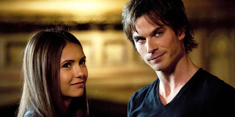 Nina Dobrev and Ian Somerhalder as Elena and Damon wearing a black jacket and black shirt smiling in 'The Vampire Diaries.'
