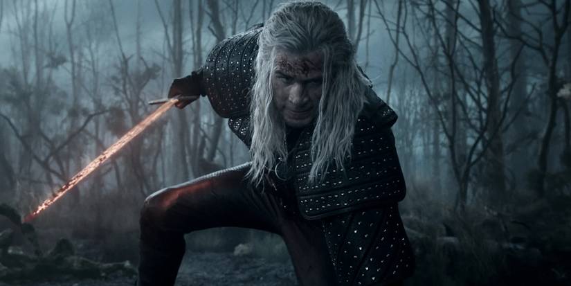 Liam Hemsworth holding a sword in a swamp in The Witcher Season 4