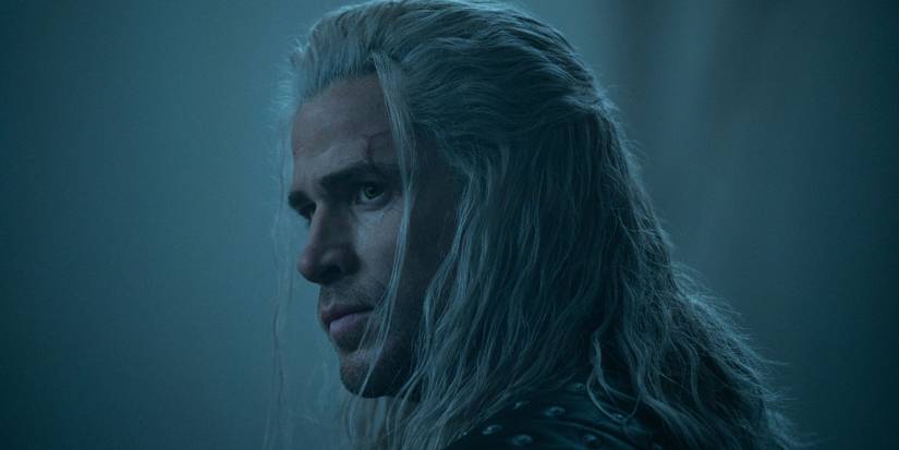 Liam Hemsworth with long white hair looking to the side in Season 4 of 'The Witcher.'
