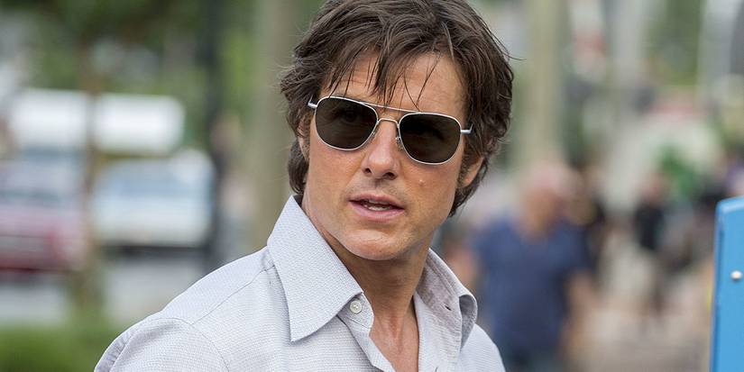 Tom Cruise as Barry Seal wearing sunglasses outside in American Made