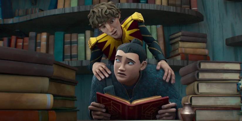 Prince Lucas looks over Hector's shoulder in the library