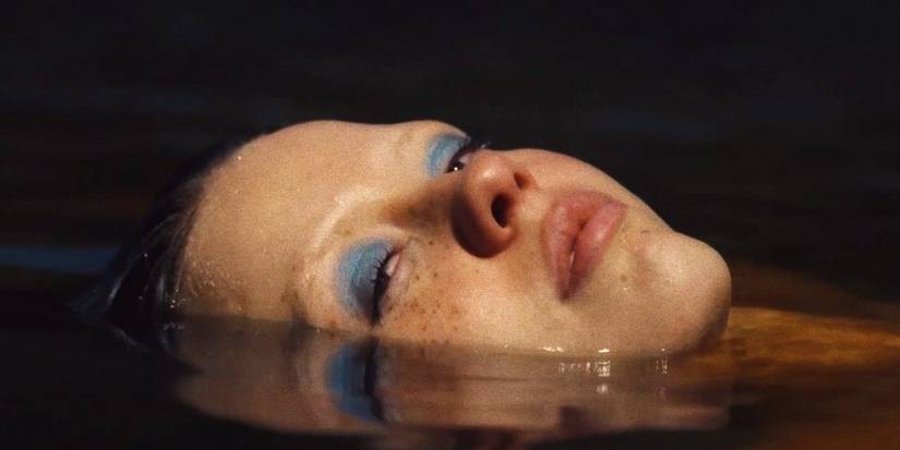 Maxine with her face coming out of the water in X