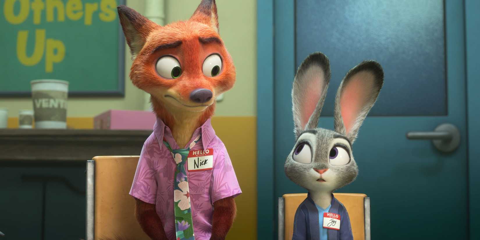 Nick Wilde and Judy Hopps sitting in chairs and wearing nametags in Zootopia 2