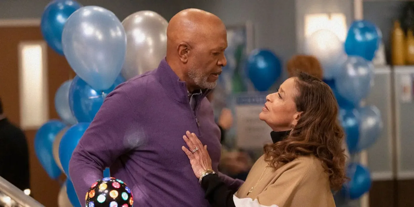 Richard Webber (James Pickens Jr.) and Catherine Fox (Debbie Allen) embrace at a party in Grey's Anatomy.
