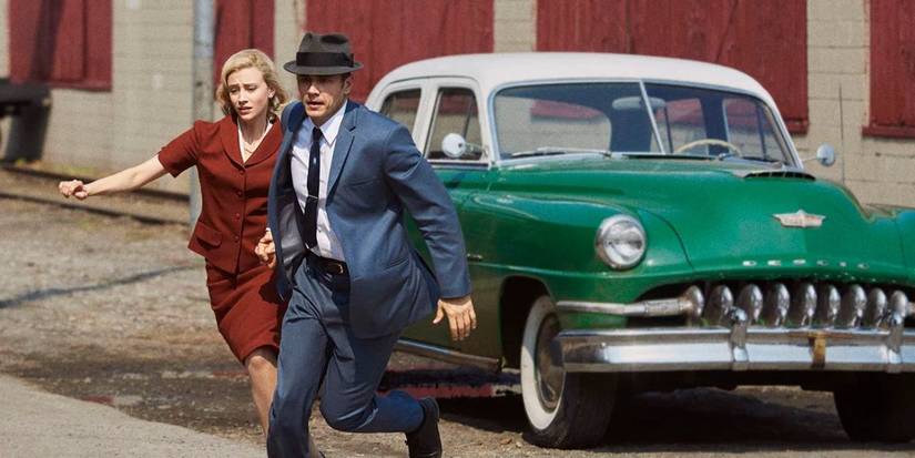 Jake Epping (James Franco) and Sadie Dunhill (Sarah Gadon) running away from a car.