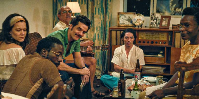 A group of people sitting together in The Secret Agent