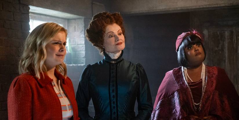 Ghosts Season 5 ensemble standing in the basement