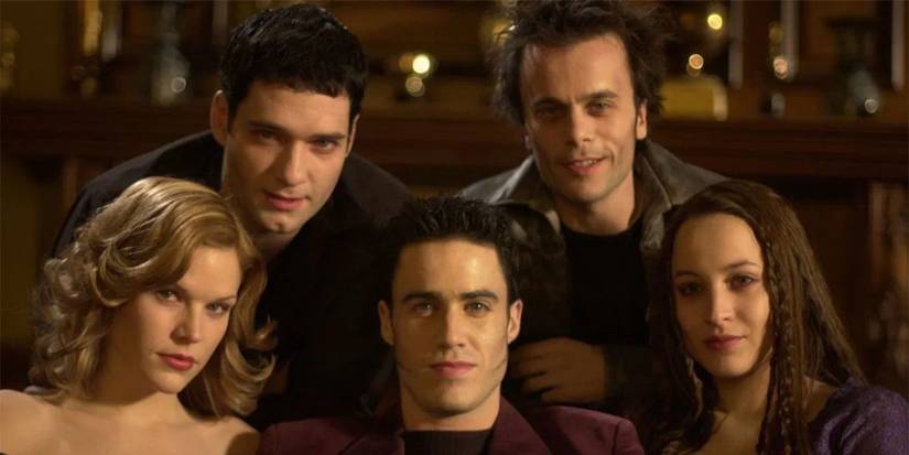 The cast of Vampire High sitting together and looking at the camera.