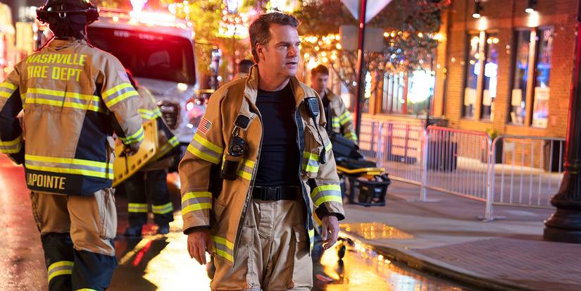 Chris O'Donnell walking in his fireman attire outside a house in the premiere of 9-1-1: Nashville
