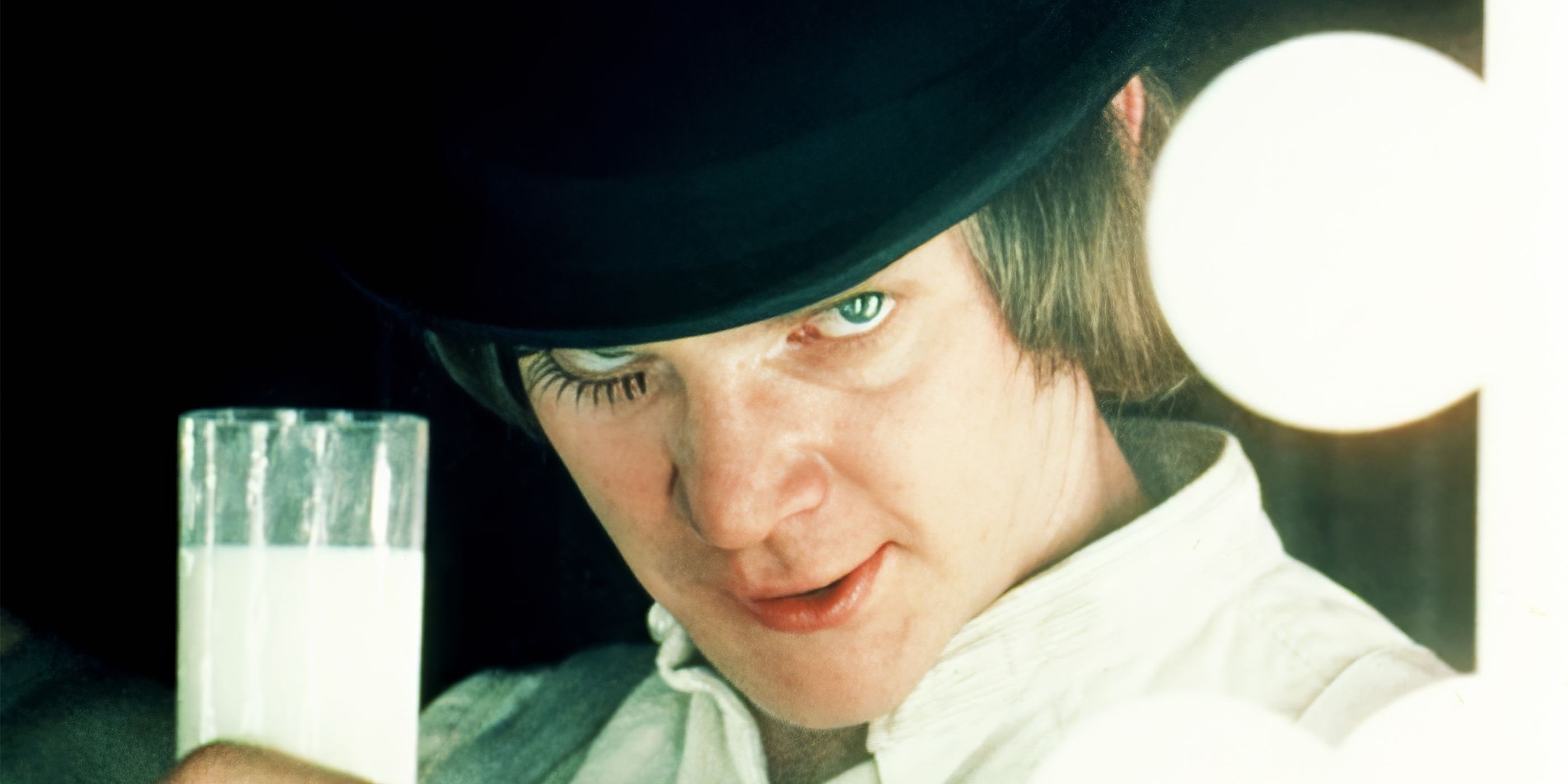 Malcolm McDowell as Alex DeLarge holding a glass of milk in 'A Clockwork Orange'