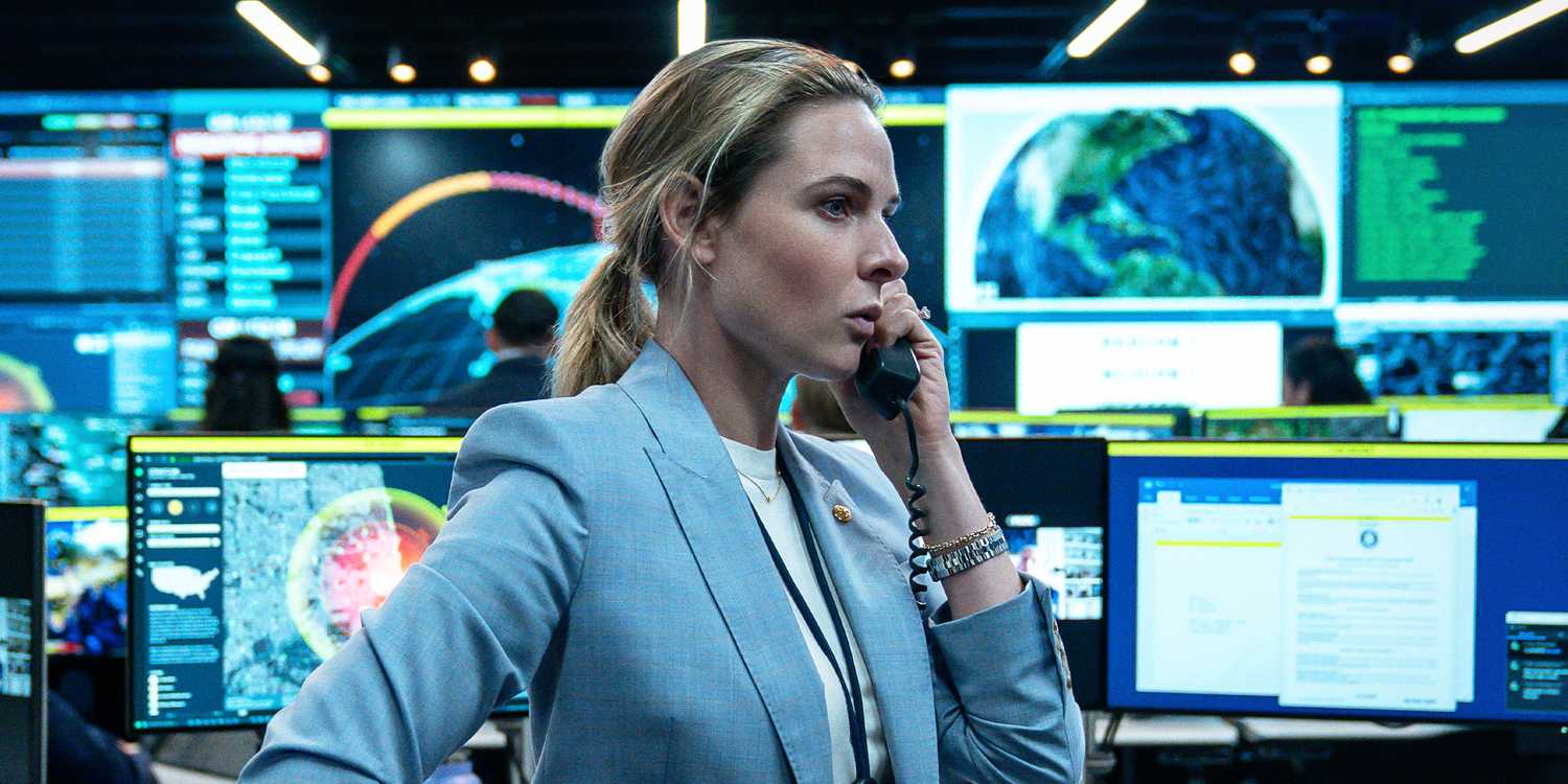 Captain Olivia Walker talking on the phone in a control room in a tense moment.