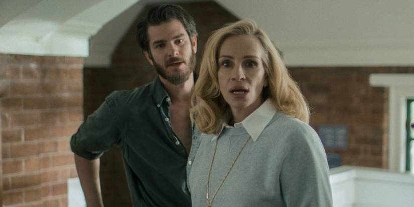 Julia Roberts' Alma standing in front of Andrew Garfield's Hank in After the Hunt.