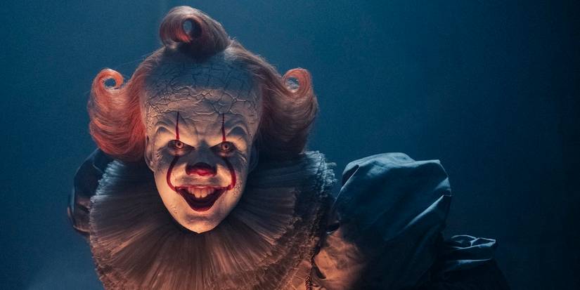 Pennywise smiles evilly in IT Welcome to Derry