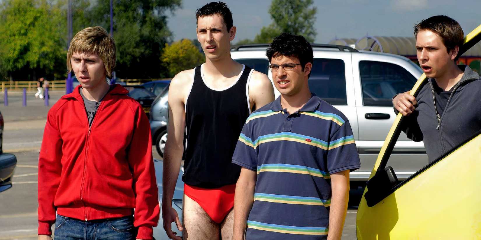 Blake Harrison, James Buckley, Joe Thomas, Simon Bird in The Inbetweeners in a parking lot.