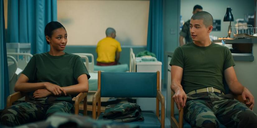 Troy Leigh-Anne Johnson as Alice and Liam Oh as Ray McaAffey sit in the infirmary in 'Boots.'