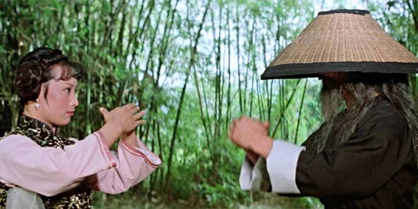 A woman and a man give bow in Broken Oath.