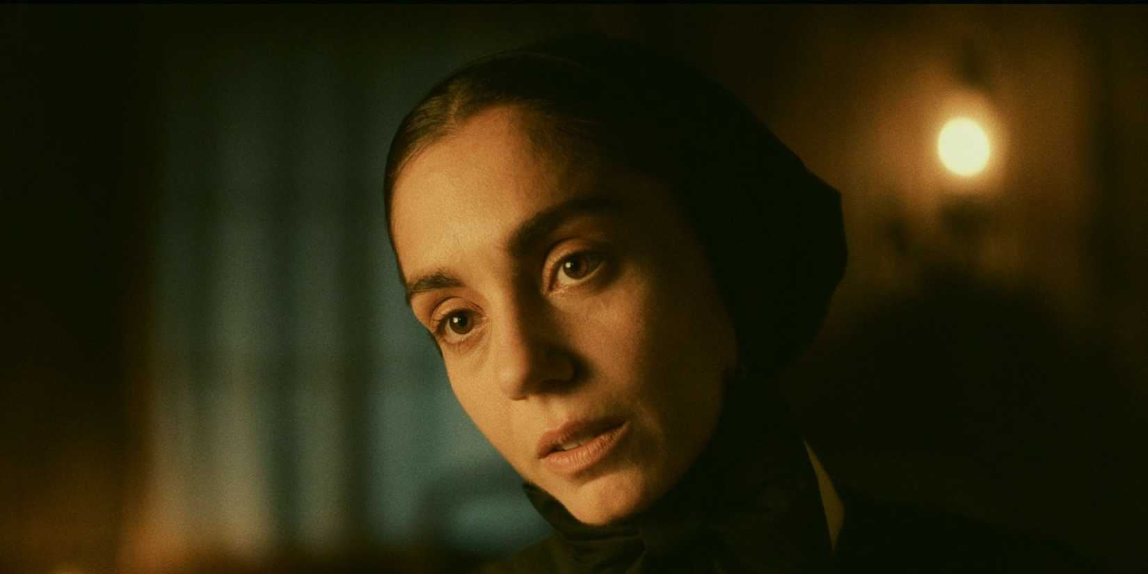 Cristiana Dell'Anna as Frances Xavier Cabrini in a close-up looking ahead in Cabrini.