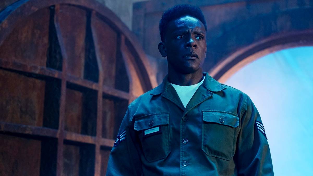 Chris Chalk walks into a sewer cautiously in IT Welcome to Derry